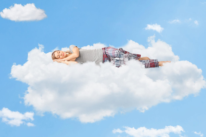 Woman sleeping on the cloud to boost productivity