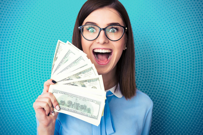 Young woman investing $1,000 dollars