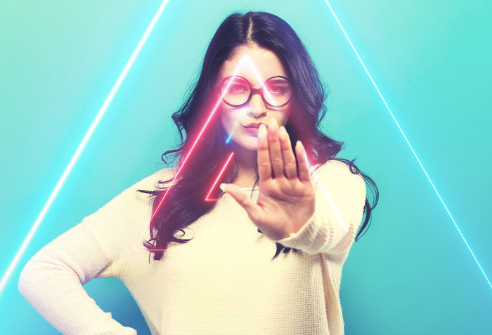 Woman says no with a hand sign