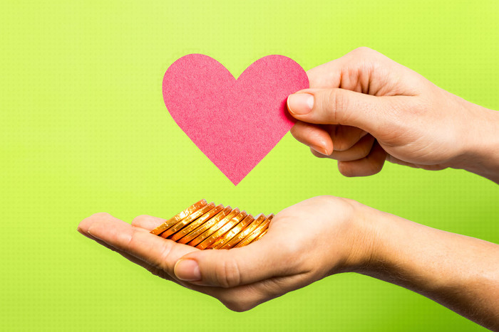 Giving hands with money symbolize that people contribute to the charity and get tax deduction