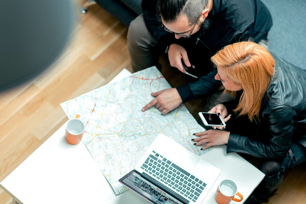 Real estate agent helps first time home buyers to calculate a budget
