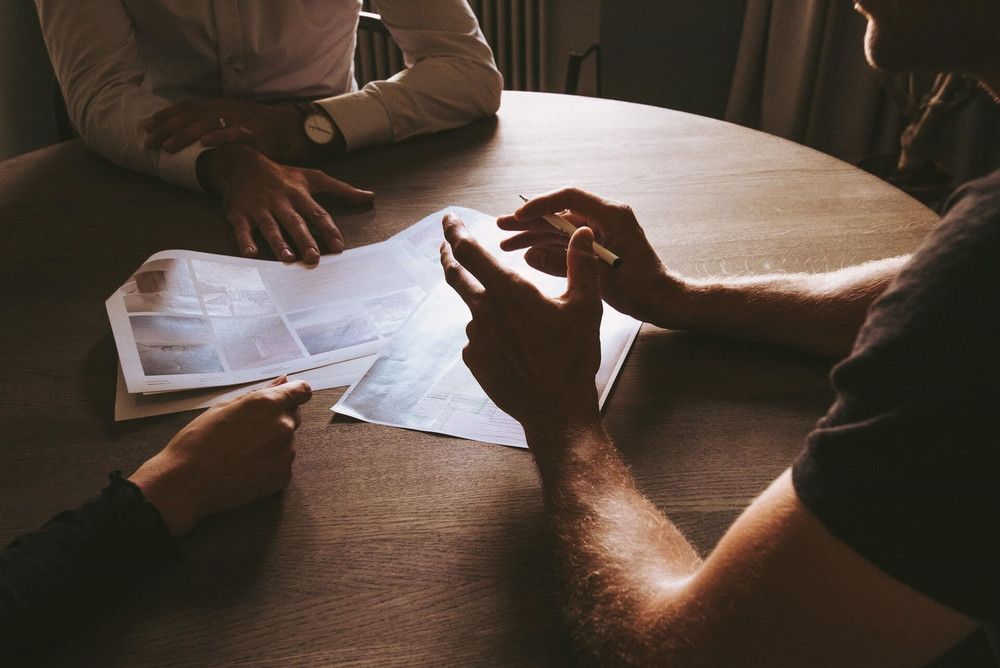 3 men discussing their schedule and how to say no when dealing with supervisor requests