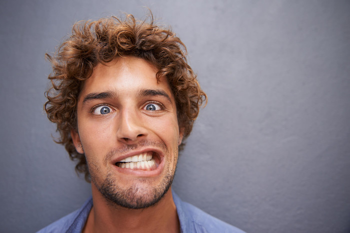 Guy smiling that doesn’t need dental insurance