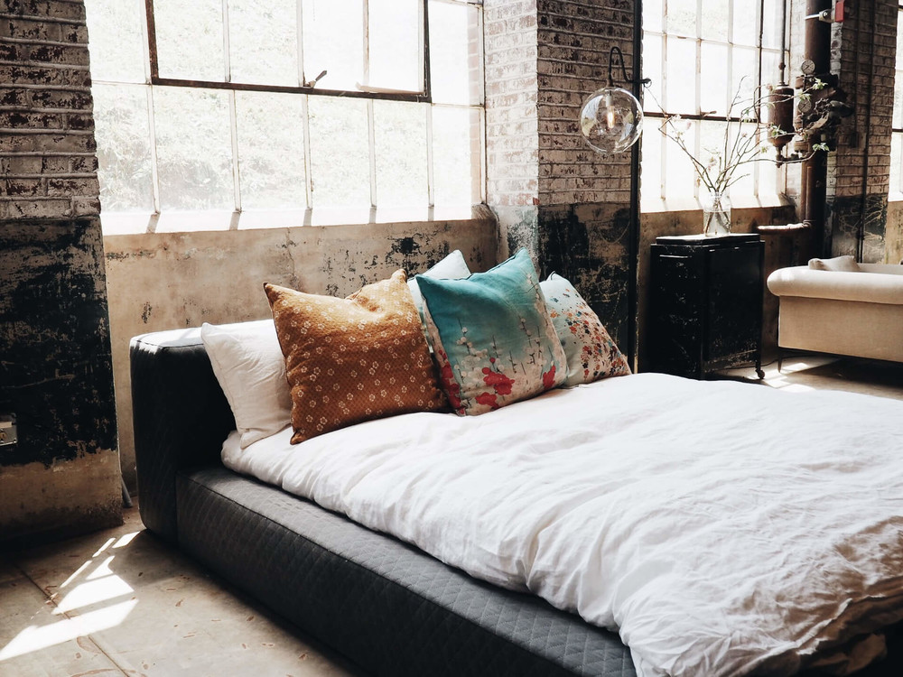 weak sleep on a bed with pillows