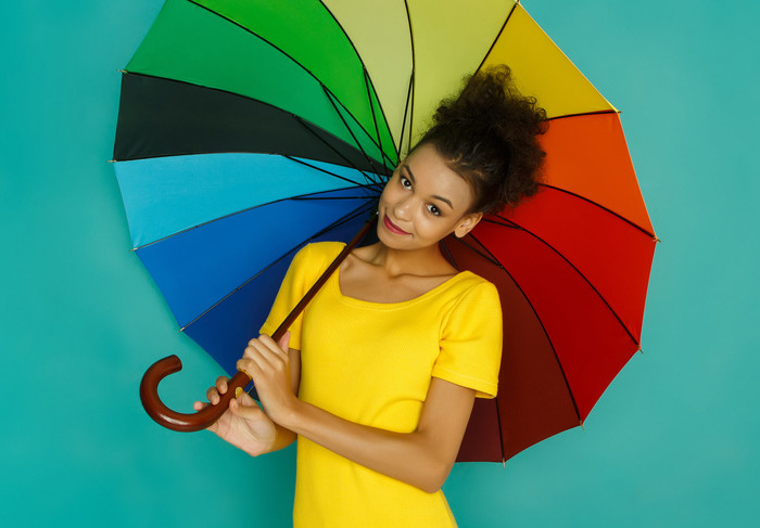 Personal insurance: woman with an umbrella symbolizes multiple aspects of insurance