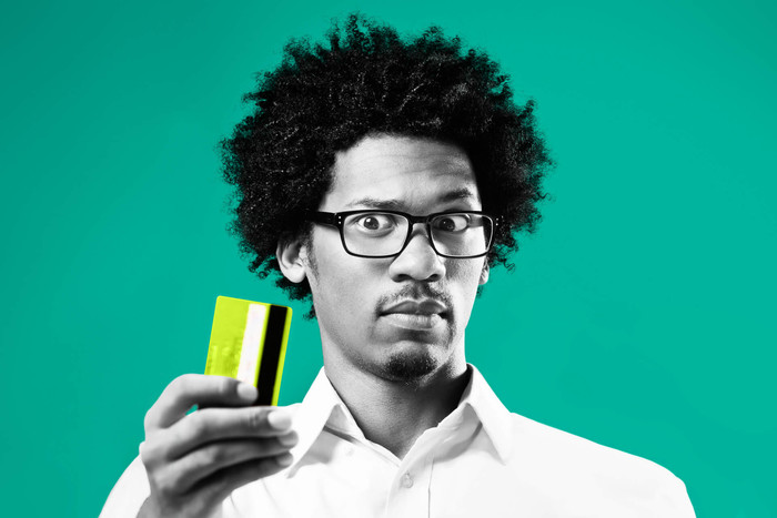 Guy showing a credit card as a way to pay mortgage