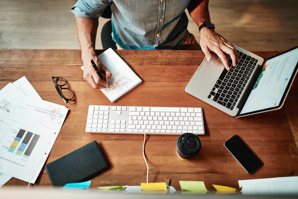 Man works productively on his laptop computer